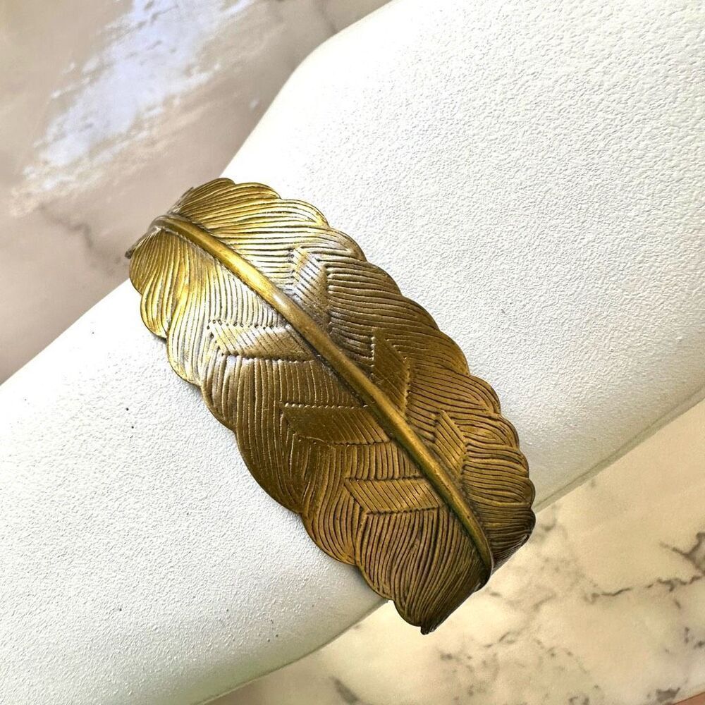 Gold tone feather bracelet